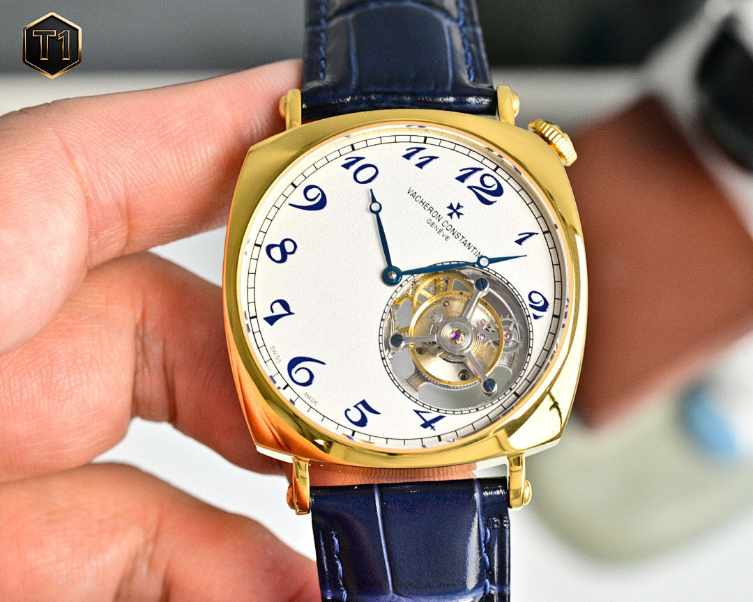 Vacheron Constantin gold-tone wristwatch with blue leather strap and open-work dial