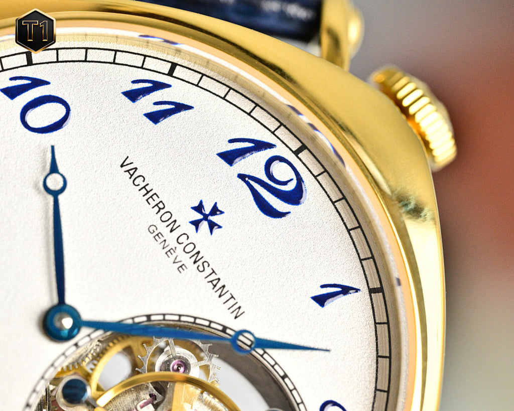Vacheron Constantin watch face close-up with blue numerals and movement window