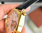 Vacheron Constantin watch side view with gold crown and black leather strap