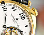 Vacheron Constantin watch dial close-up with gold bezel and Roman numerals