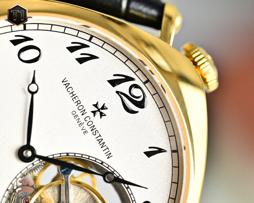 Vacheron Constantin watch dial close-up with gold bezel and Roman numerals