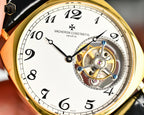 Vacheron Constantin watch face close-up with black leather strap and gold case