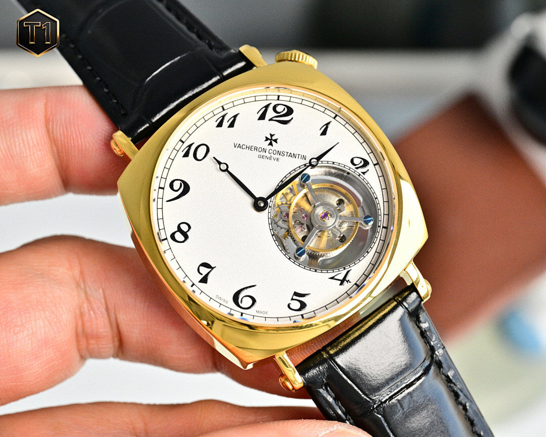 Vacheron Constantin watch with gold case and black leather strap, open dial window view