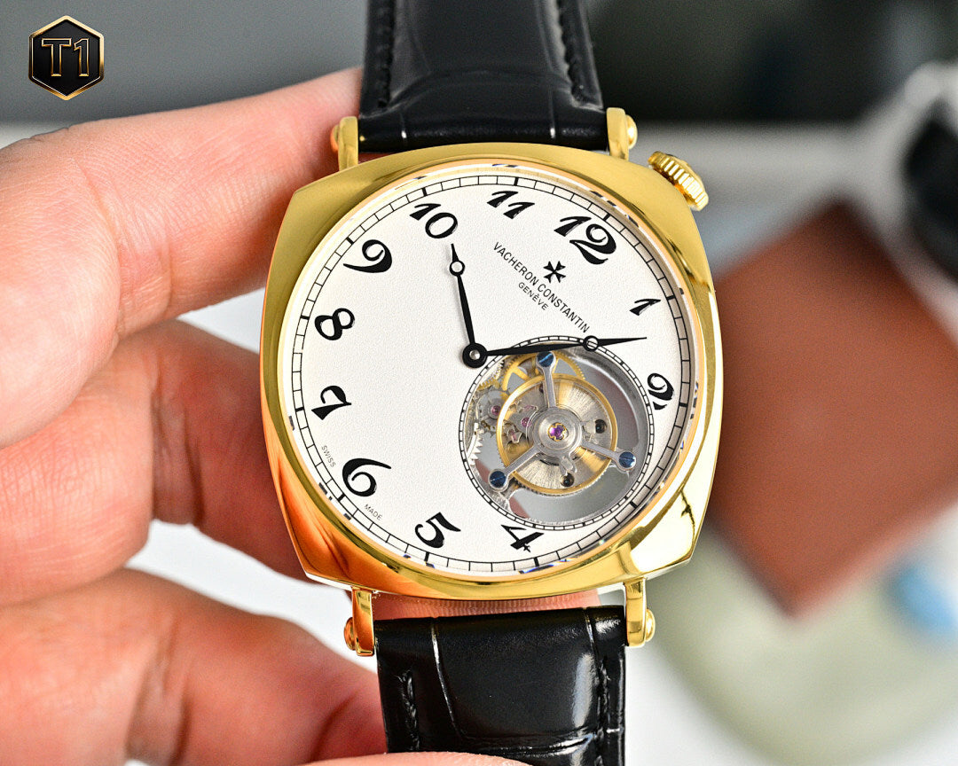 Vacheron Constantin watch front view with gold bezel, white dial, black leather strap