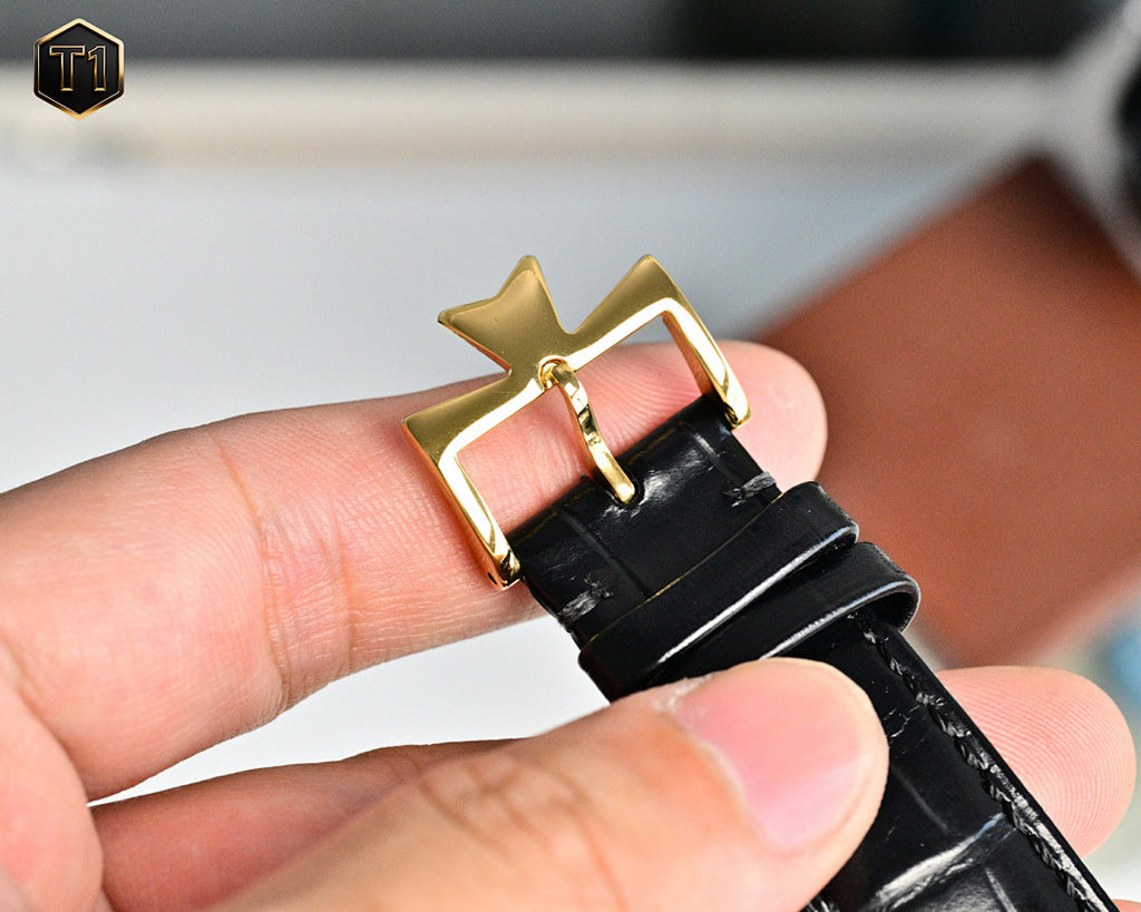Vacheron Constantin watch showing black leather strap end with gold clasp
