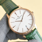Vacheron Constantin wristwatch with white dial, green leather strap, rose-gold case