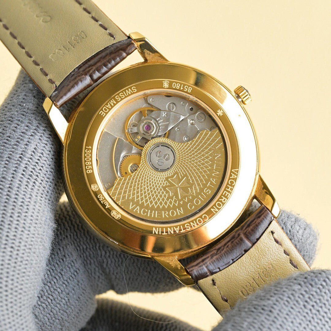 Vacheron Constantin watch caseback with engraved movement and brown leather strap