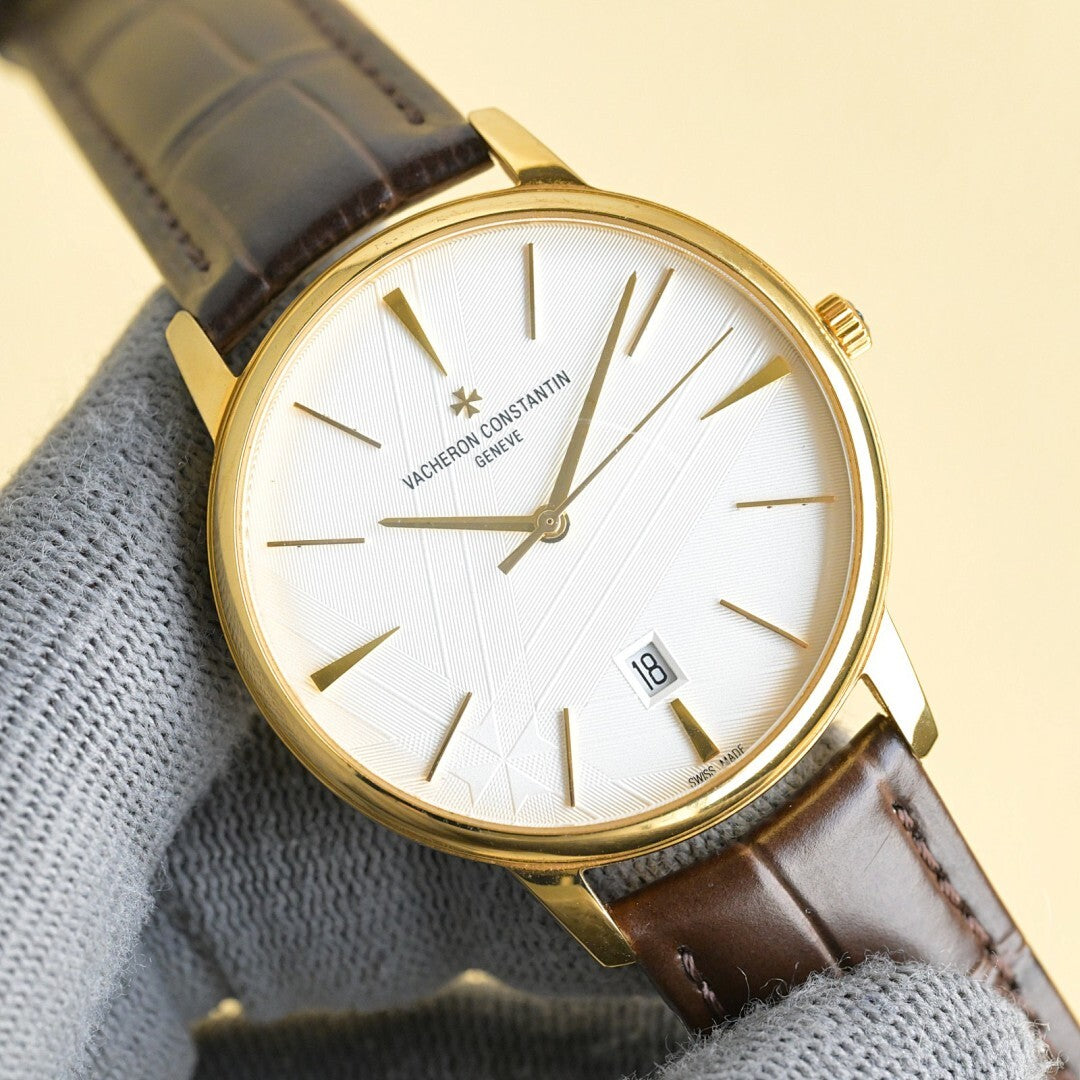 Vacheron Constantin watch with white dial, gold hands, brown leather strap, date window 18