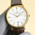 Vacheron Constantin watch with white dial, gold case, brown leather strap, date window 18