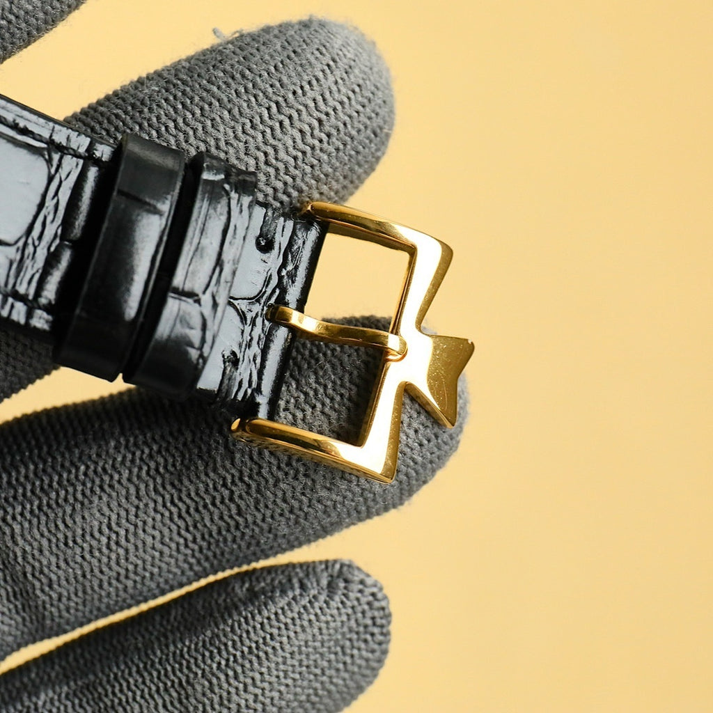 Black leather watch strap with gold deployant clasp and gold pin, Vacheron Constantin