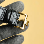 Black leather watch strap with gold deployant clasp and gold pin, Vacheron Constantin