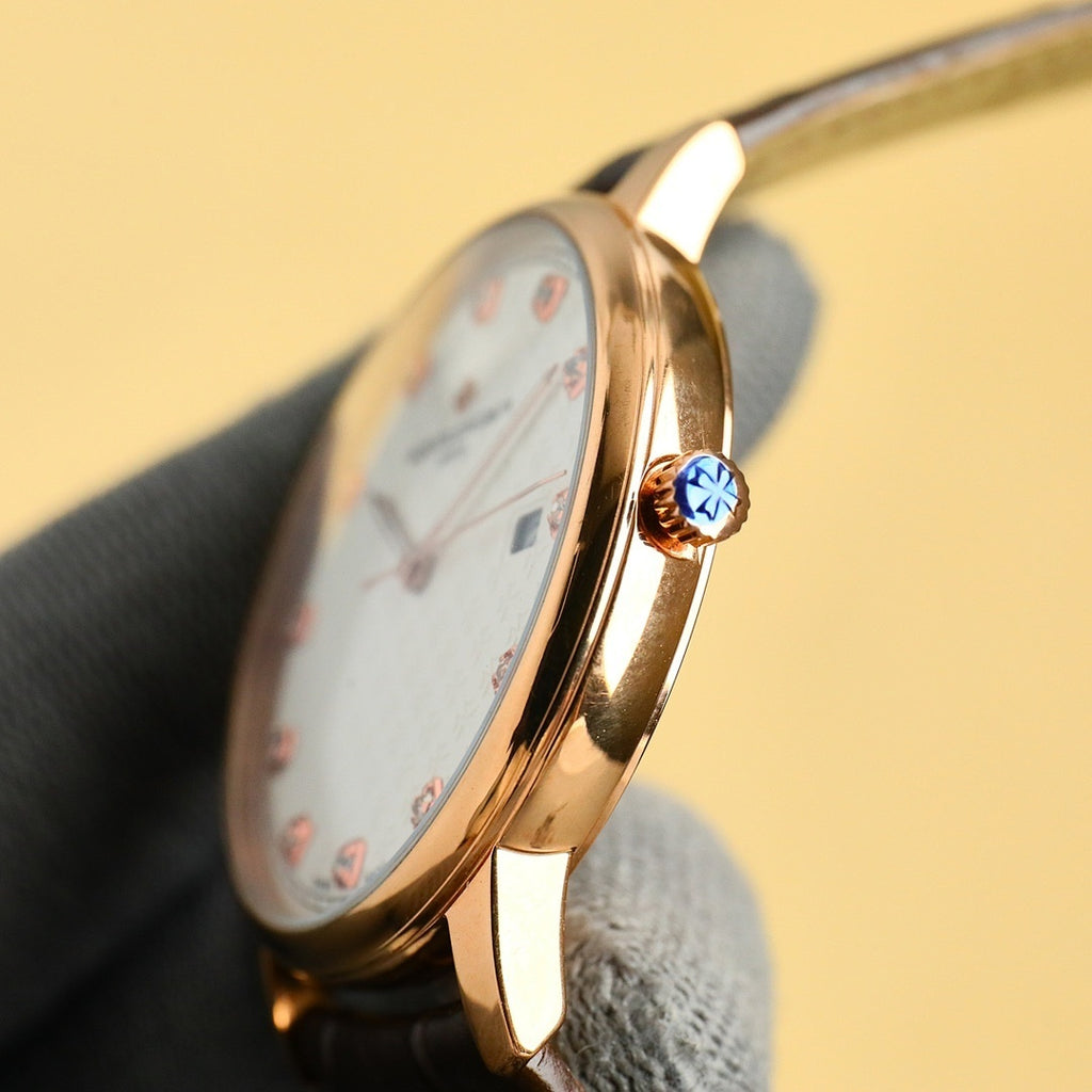 Gold Vacheron Constantin watch with crown detail and black strap, side profile