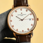 Gold Vacheron Constantin watch with white dial, red diamond markers, black leather strap