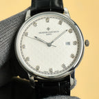 Silver Vacheron Constantin watch with white dial, diamond markers, black leather strap