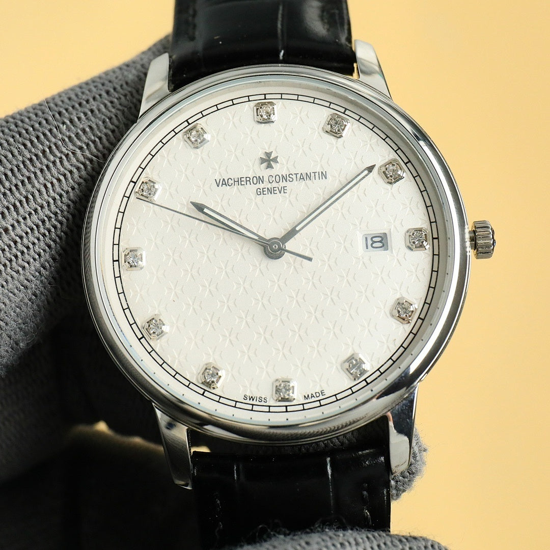 Silver Vacheron Constantin watch with white dial, diamond markers, black leather strap