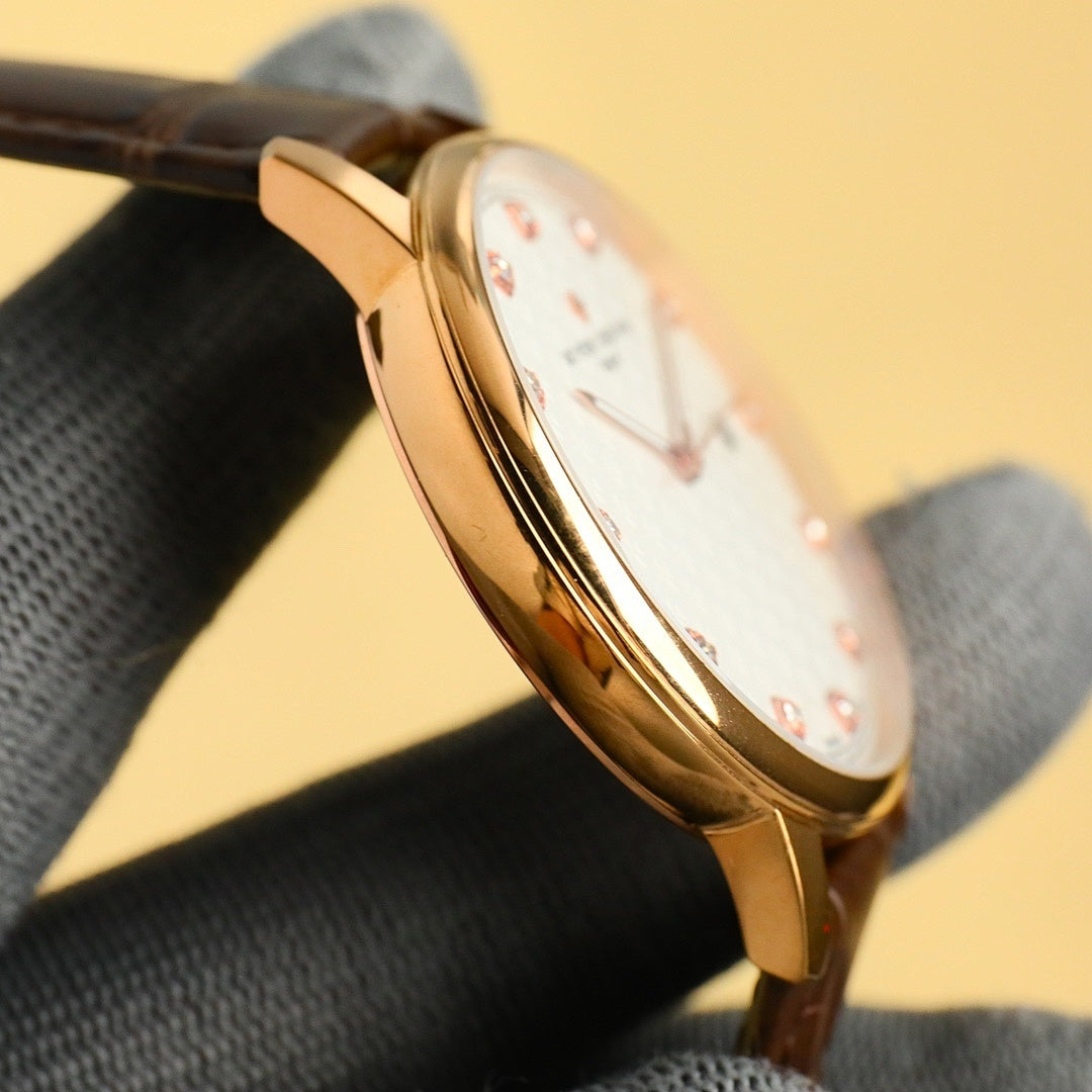 Gold Vacheron Constantin watch case and bezel with black leather strap, side view
