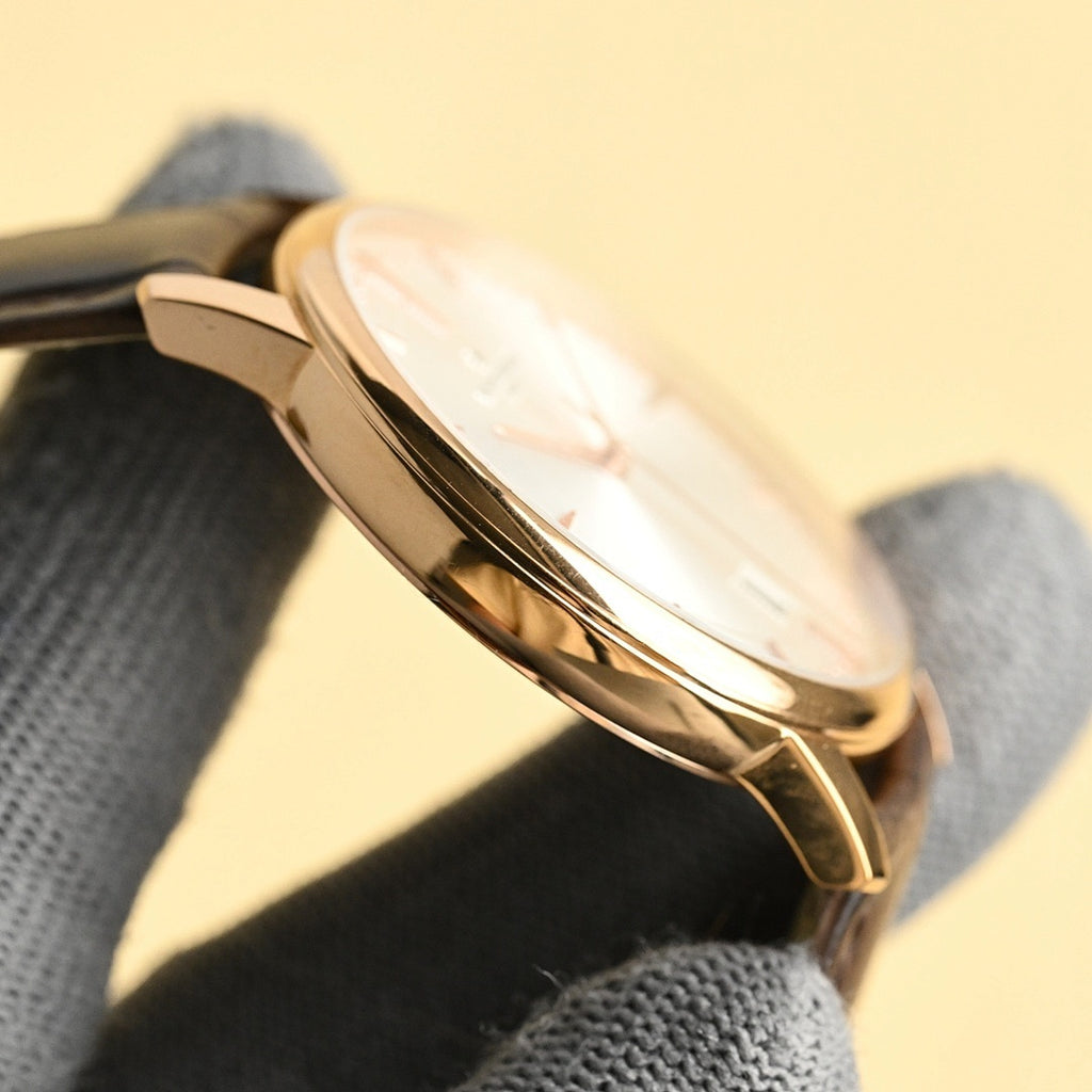 Vacheron Constantin watch showing rose-gold case side with black leather strap
