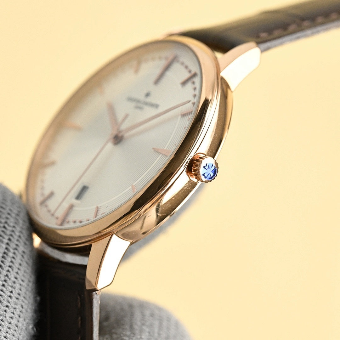 Vacheron Constantin watch with white dial, gold-tone case, and black leather strap