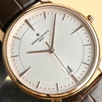 Vacheron Constantin watch face close-up with silver sunray dial and brown leather strap