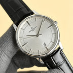Vacheron Constantin watch with silver dial, steel case, and black leather strap