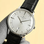 Vacheron Constantin watch with silver dial and black leather strap, angled view