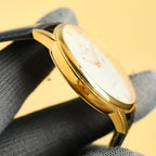 Vacheron Constantin wristwatch side view, gold-tone case with crown and leather strap