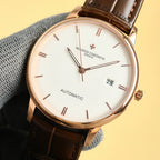 Vacheron Constantin automatic wristwatch with white dial, gold-tone case, date 25, brown strap