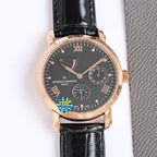 Gold-tone wristwatch with dark dial, Roman numerals, black leather strap, date window.