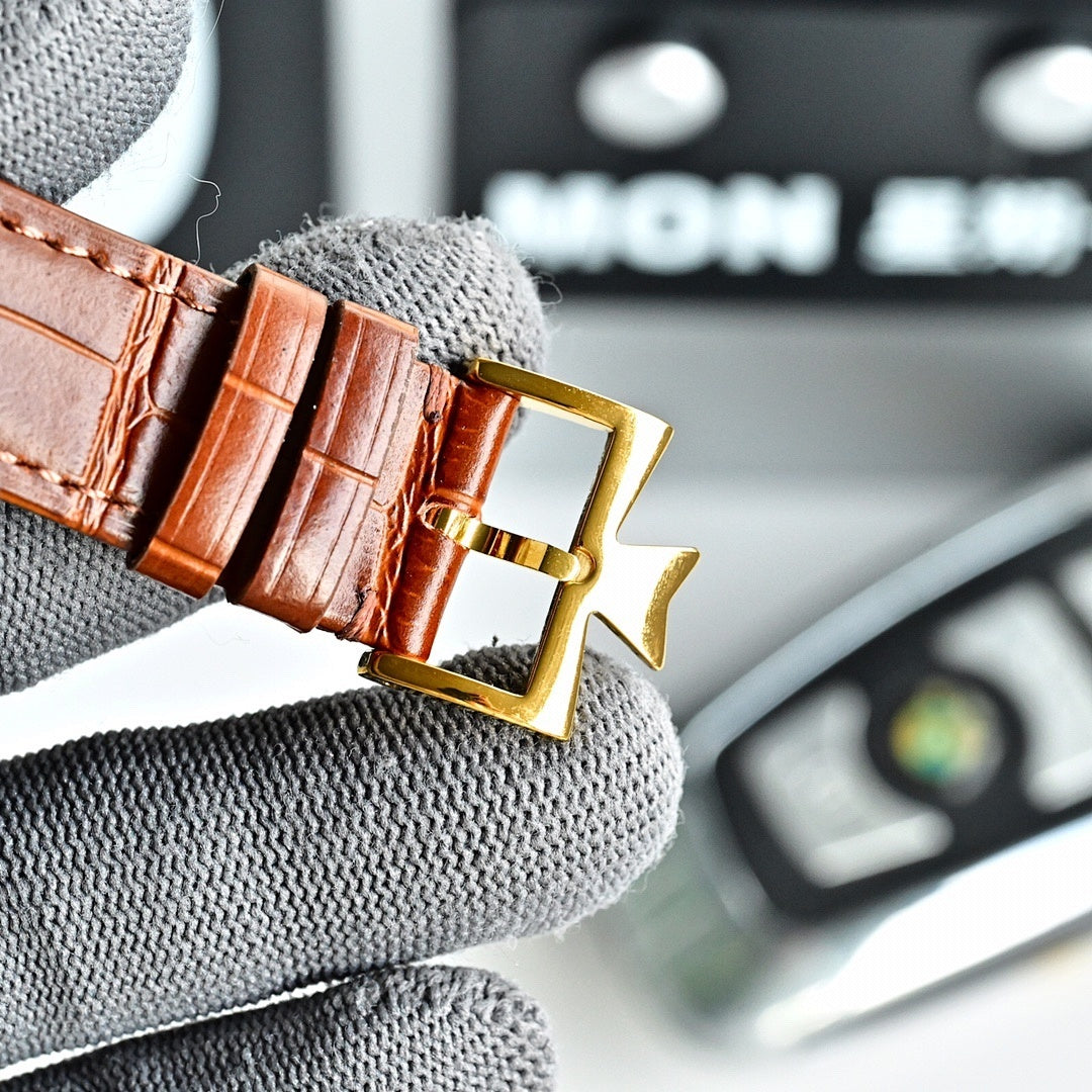 Gold-tone watch clasp with brown leather strap and rectangular buckle