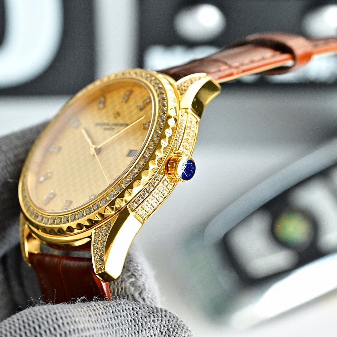Gold-tone watch with champagne dial, brown leather strap, jeweled bezel, blue crown accent