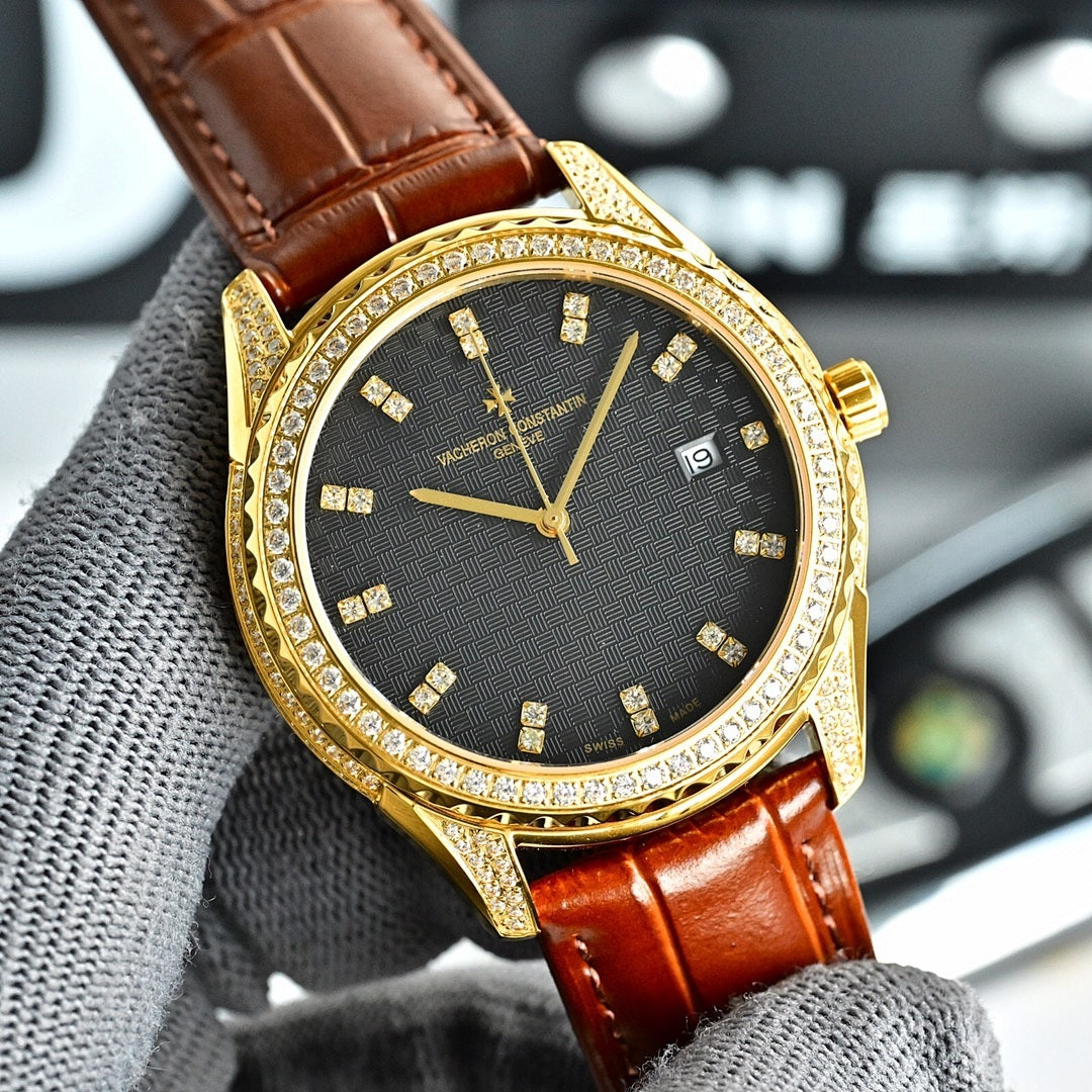 Gold-tone watch with dark dial and gold markers, brown leather strap, jeweled bezel, date