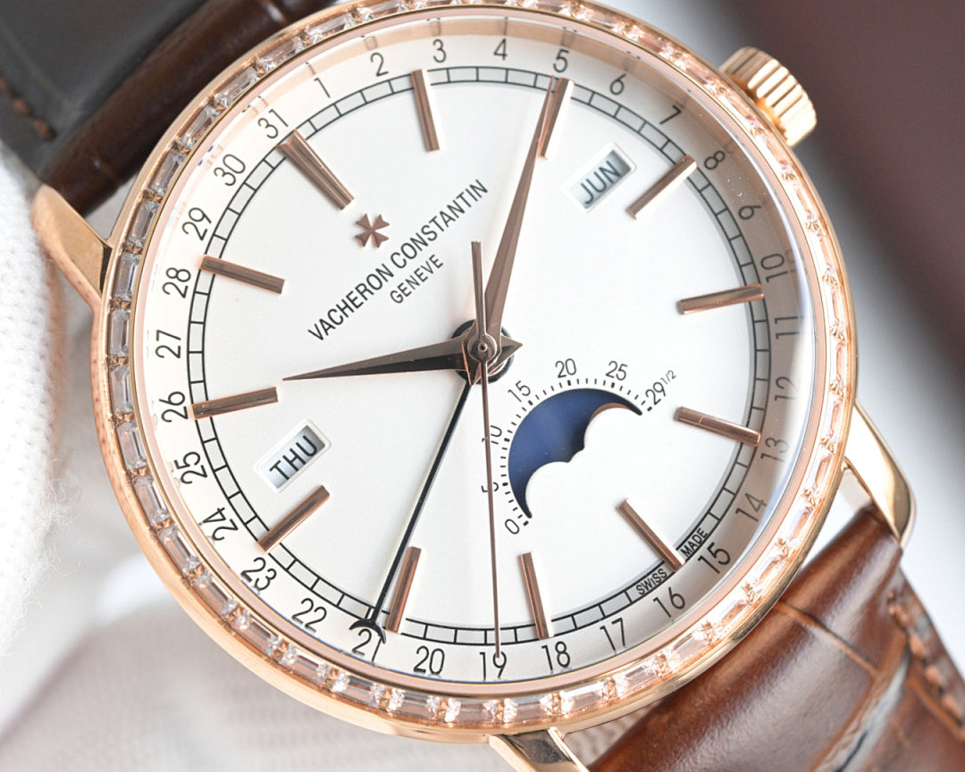 Rose-gold watch close-up: white dial, moonphase, day window, brown leather strap