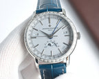 Luxury wristwatch front view with white dial, silver case, and blue leather strap; slim lugs.