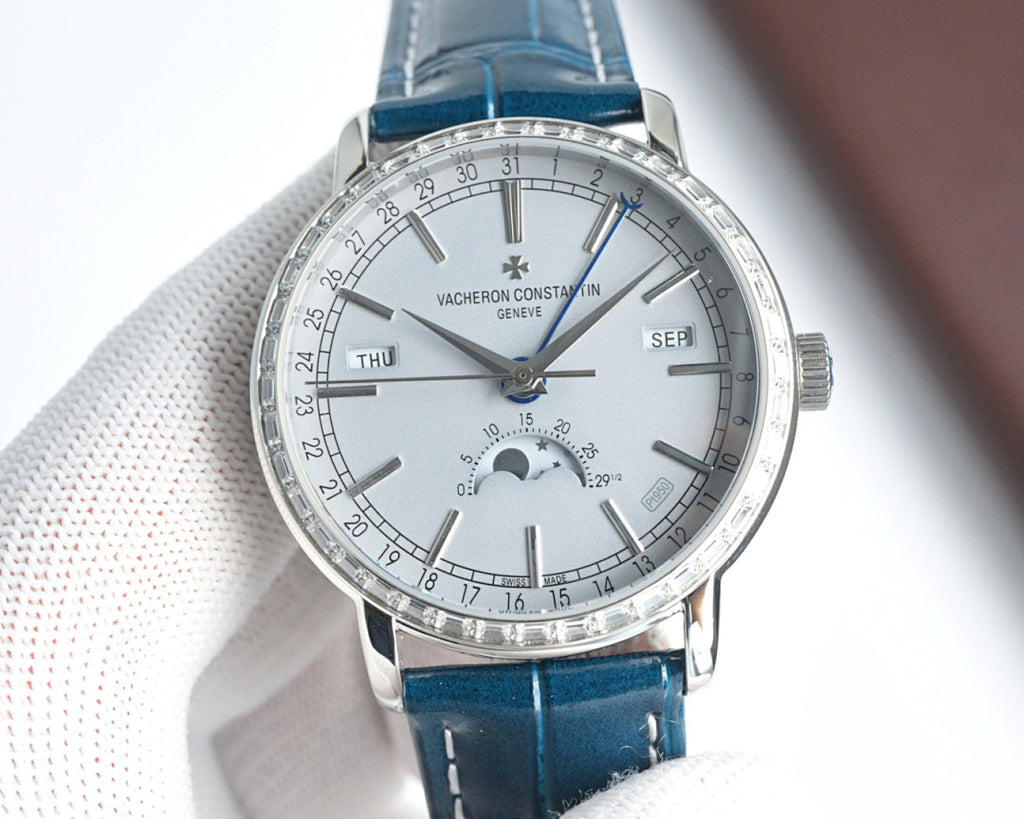 Luxury wristwatch with white dial, silver case, and blue leather strap; visible subdials.