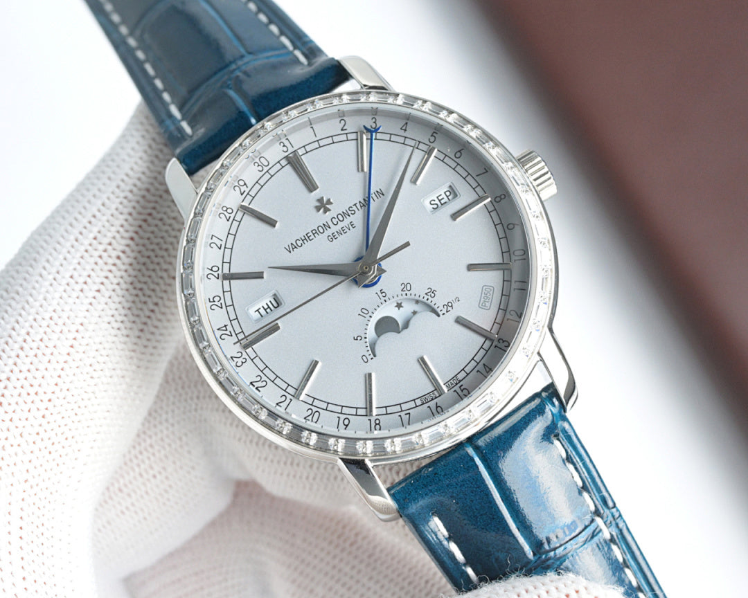 Luxury wristwatch angled view with white dial, silver bezel, and blue leather strap; day/date.