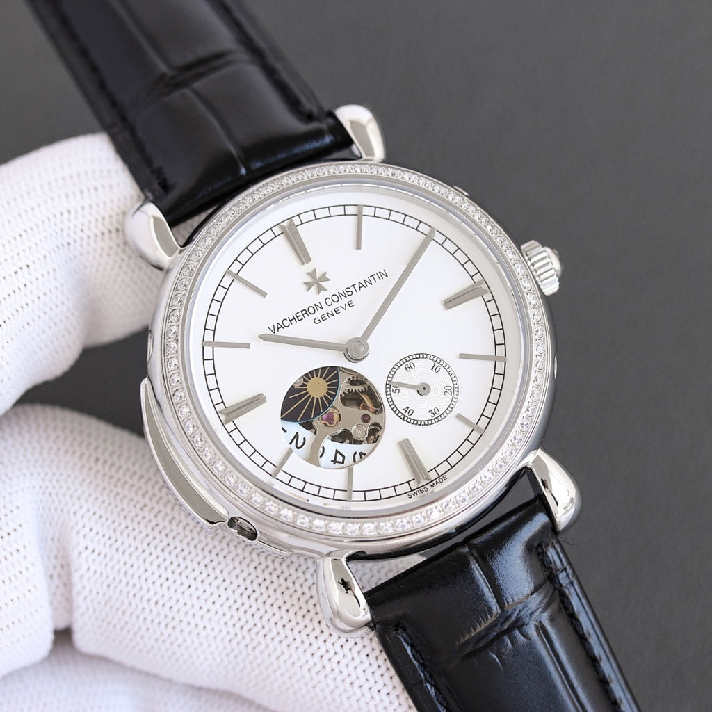Silver watch with white dial, subdials, and black leather strap
