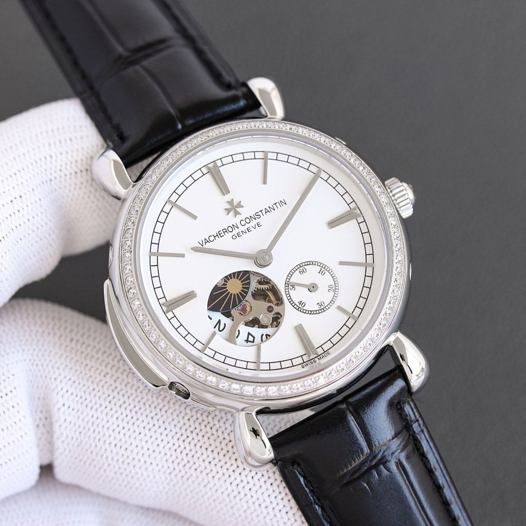 Silver watch with white dial, subdials, and black leather strap