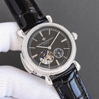Silver watch with black dial, white indices, and black leather strap, diamond bezel detail