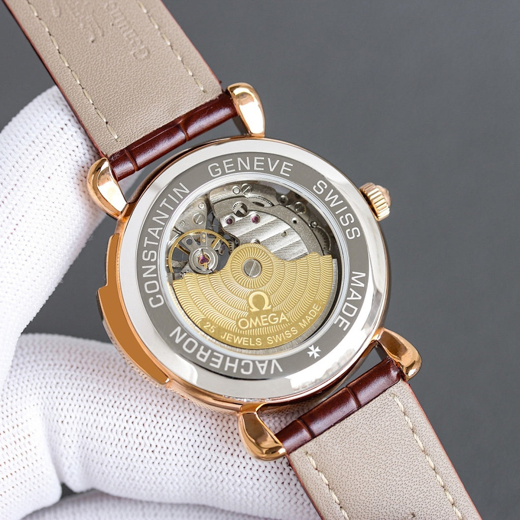 Luxury watch case back with rose gold-toned finish, visible movement, leather strap loop