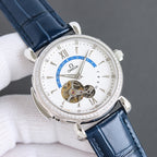 Luxury watch with blue leather strap, silver case, white dial, diamond bezel, visible mechanical dial