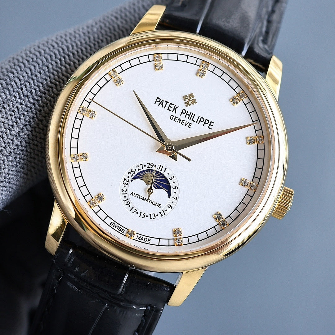 Gold wristwatch with white dial and black leather strap; baton markers and moon-phase subdial.