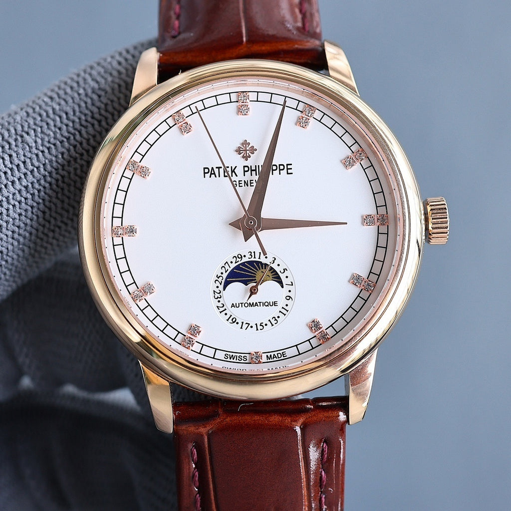 Gold wristwatch with white dial and brown leather strap; baton markers and moon-phase.
