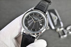 Vacheron Constantin round watch with black dial and black leather strap