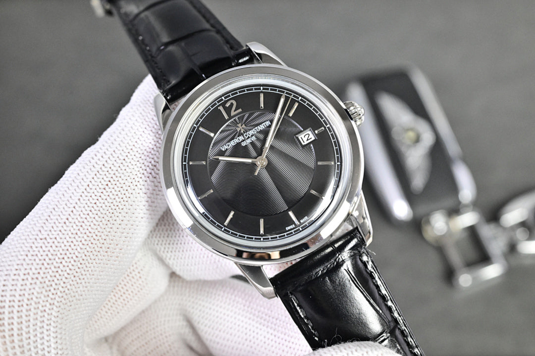 Vacheron Constantin watch with black dial, silver bezel, and black leather strap