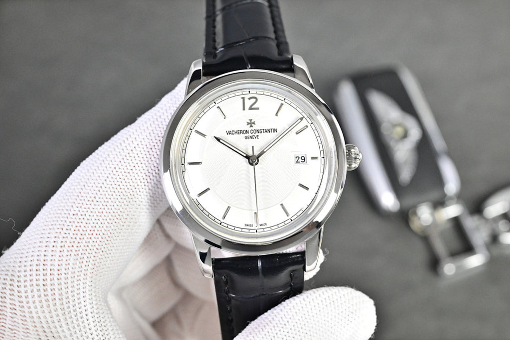 Vacheron Constantin watch with white dial and black leather strap, visible hour markers