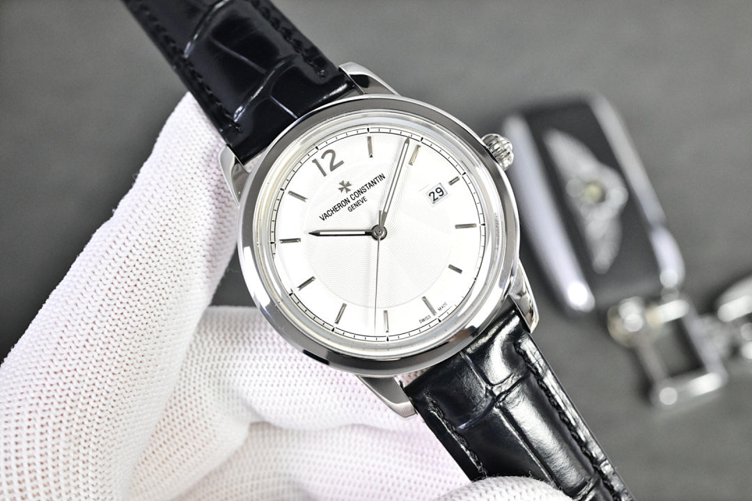 Vacheron Constantin watch with white dial, black leather strap, and silver case