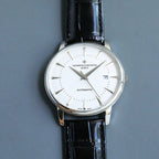 Automatic wristwatch with white dial and black leather strap, round silver case