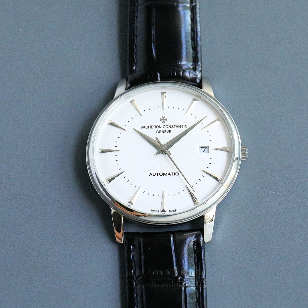 Automatic wristwatch with white dial and black leather strap, round silver case