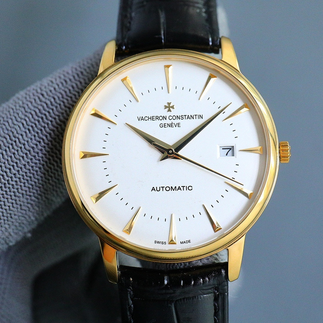 Gold-tone automatic wristwatch with white dial, black leather strap, gold hands and markers.