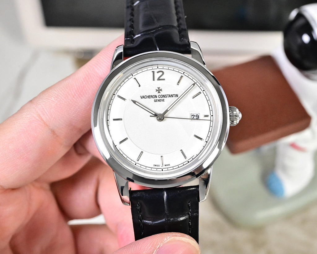 Wristwatch front with white dial, silver case, and black leather strap